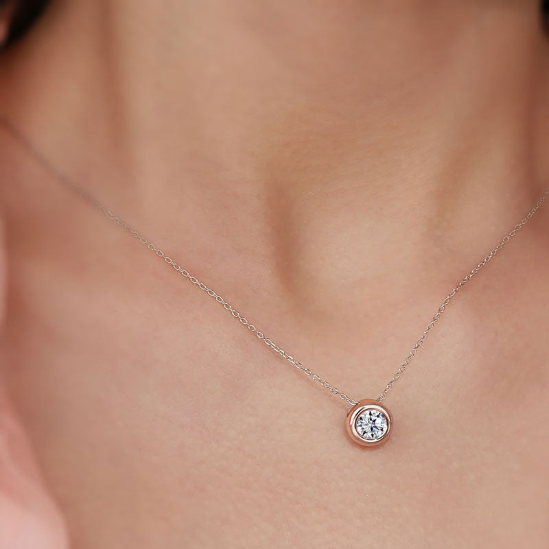 Wearing a bezel Solitaire Moissanite Necklace rose gold