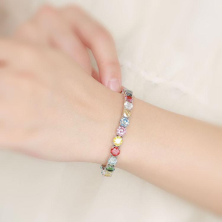 Woman wearing multi-colored bracelets